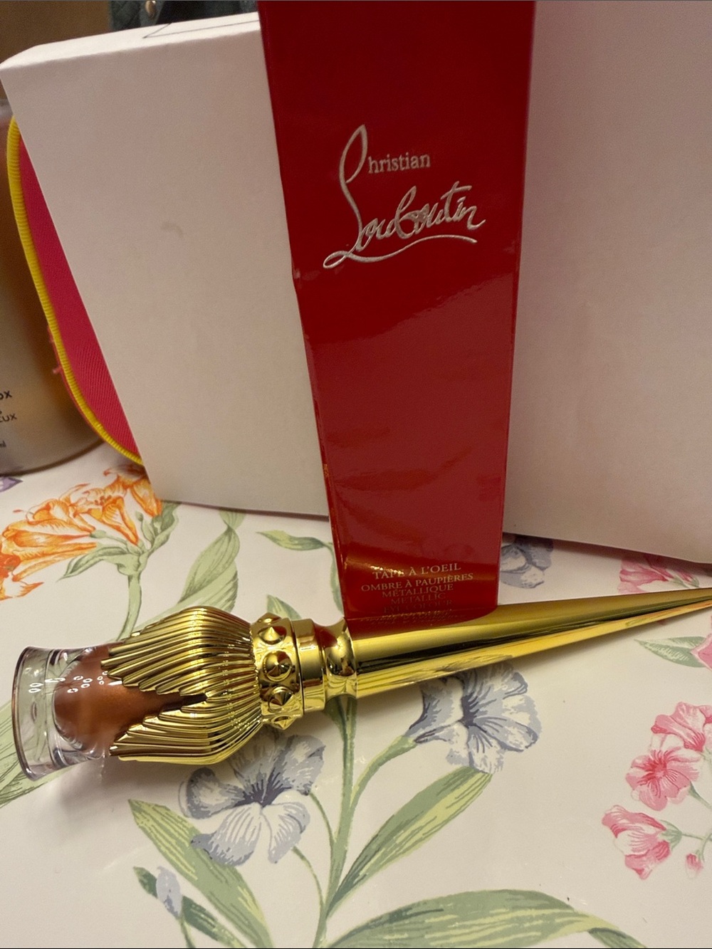 Christian Louboutin Gold and Clear Decorative Bottle Accent.